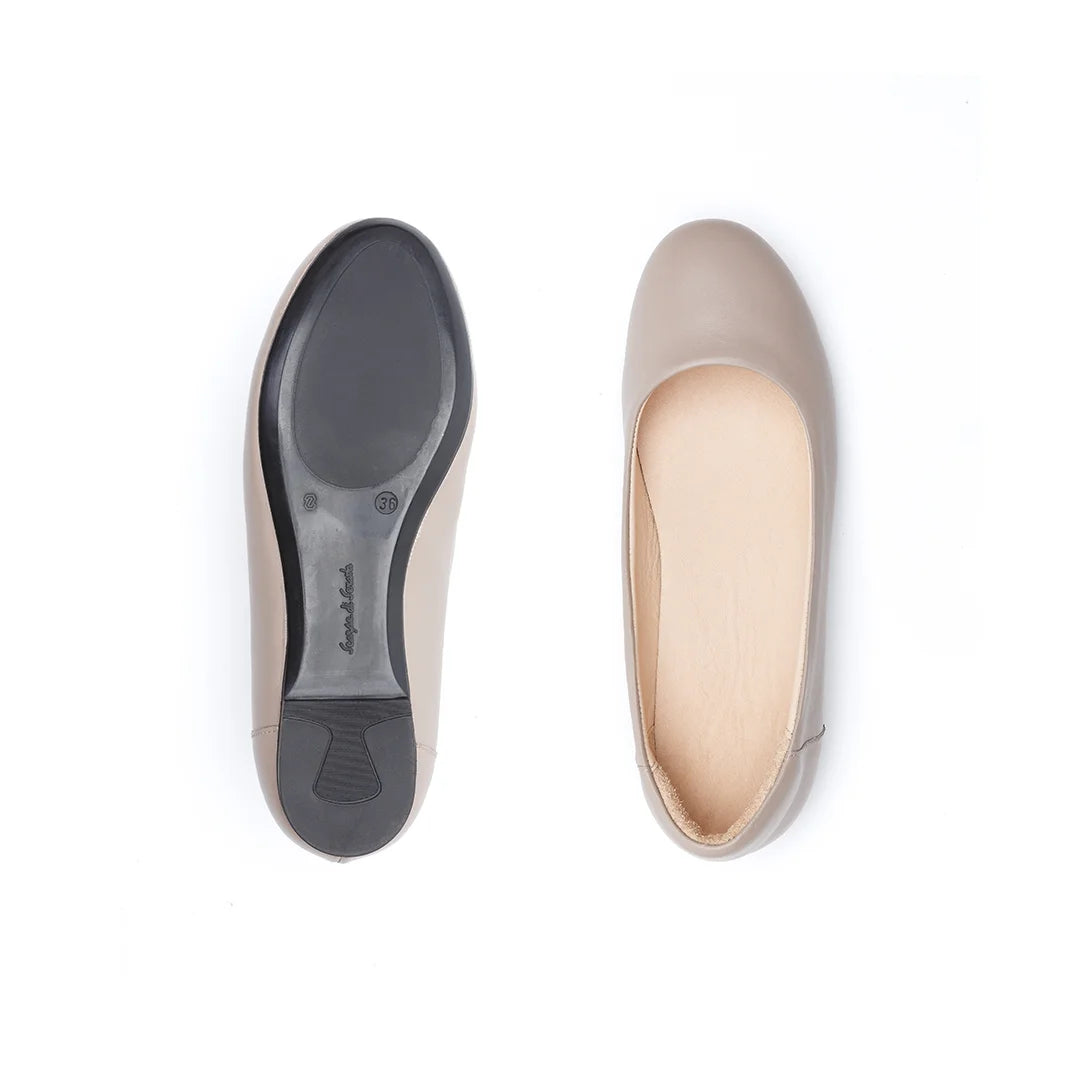 Beige leather slip-on shoes for women with stable sole and orthopedic construction.