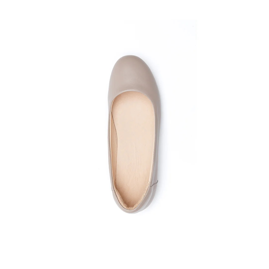 Women’s wide fit orthopedic beige ballet flats providing comfort for tired feet.