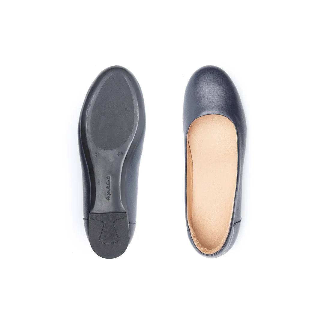Women’s navy leather wide fit flats with rigid sole for extra stability.