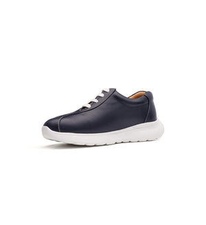 Navy 611-UNI lace-up shoe with a white sole, viewed from the opposite front angle.