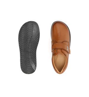 Women's tan comfort footwear featuring a spacious fit and supportive sole construction.