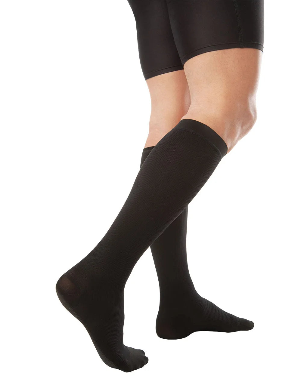 Compression socks providing graduated pressure to improve circulation and reduce leg fatigue