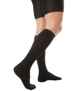 Compression socks providing graduated pressure to improve circulation and reduce leg fatigue