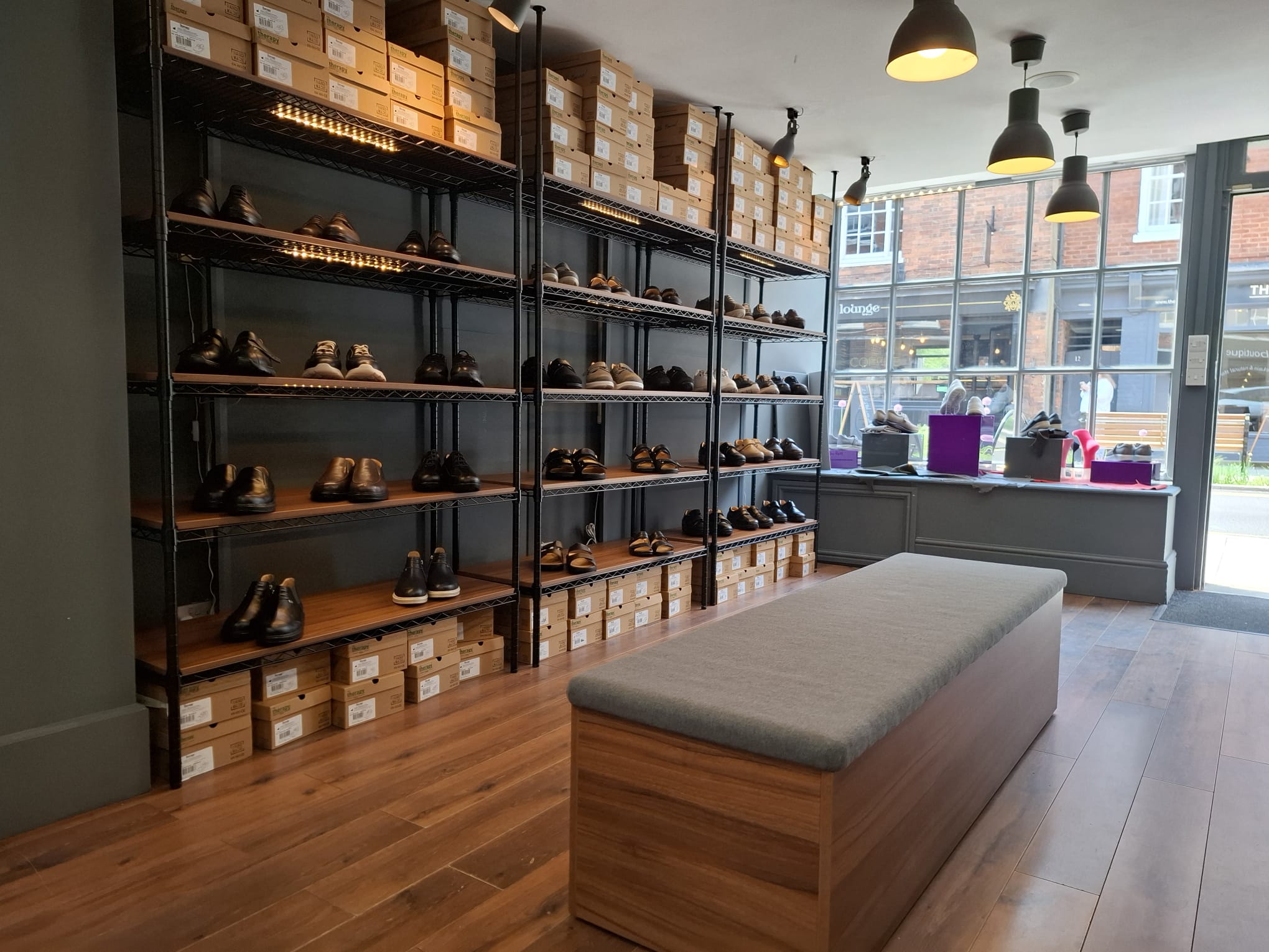 Bright interior of TDO Therapy orthopaedic and diabetic footwear showroom in Farnham offering specialist shoe fitting and expert advice